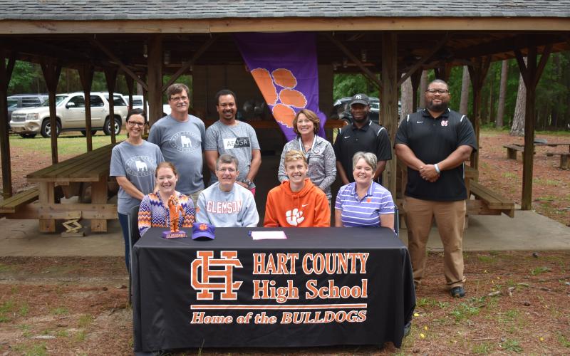 Photo submitted — Pictured are, back row, from left to right, assistant Hart County High School cross country coach Ana Gordy, head coach Cecil Marrett, Floyd Ramsey, HCMS Deborah Rogers, Tevin Glaze and Kendall Rucker. On the front row are, from left to right, Gabrielle Garringer, Sam’s sister, his father Jodon Garringer, Sam Garringer and mother Marcie Garringer.