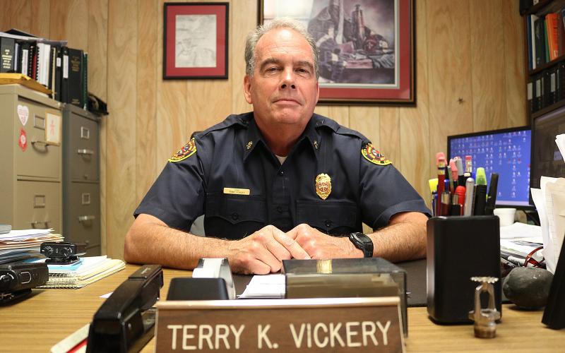 Sunshot by Grayson Williams — Hartwell fire chief Terry Vickery poses for a photo in his office. Vickery will retire at the end of this year after 45 years on the job with the Hartwell Fire Department.
