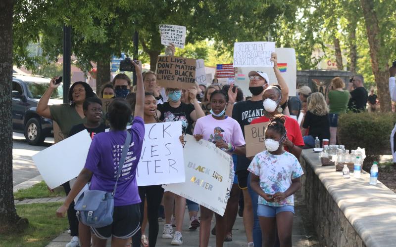 Sunshot by Grayson Williams — Protesters march around the Hart County Courthouse square in downtown Hartwell on Friday, June 5.