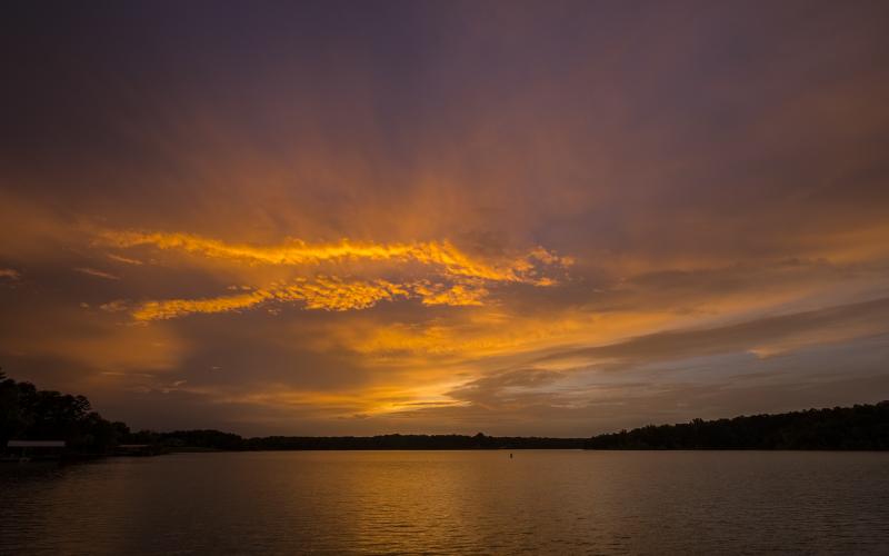 Sunshots by Bill Powell — The sun sets over Lake Hartwell and paints the sky hues of orange on Saturday, June 26, as a massive plume of dust from the Saharan Desert passes over the Southeastern U.S.