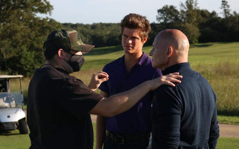 Sunshot by Grayson Williams “The Green” director Justin Sterner, left, talks to actors, Travis James, center, and Barry Piacente, right, on Tuesday at Cateechee during production of a pilot creators hope will be picked up by a network or streaming service.