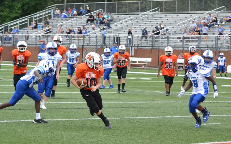 10U runner Aiden Kennedy finds a big hole through Banks County defenders on his way to the end zone.