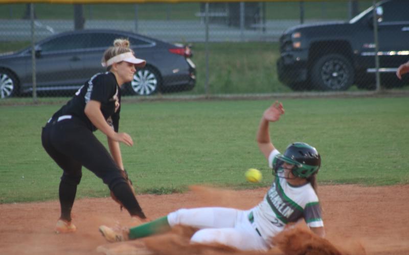 Sunshot by Grayson Williams - Hart County’s Anslee Mitchell fields a throw in an attempt to get a Franklin County base runner out on Sept. 3 in Franklin County.