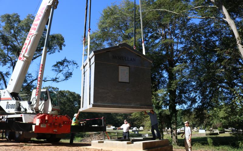 Sunshot by Grayson Williams - A 30-ton mausoleum is lowered with a crane onto its foundation at Northview Cemetery on Oct. 2.