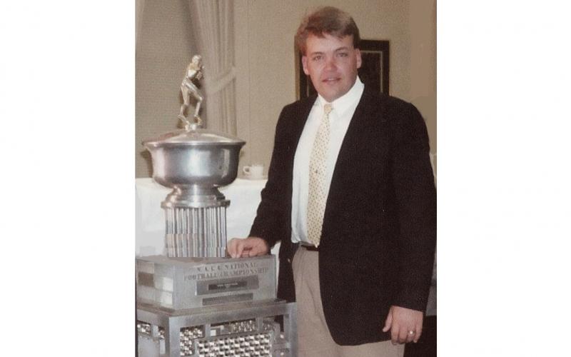 Jay Floyd with a Carson-Newman national championship trophy. 