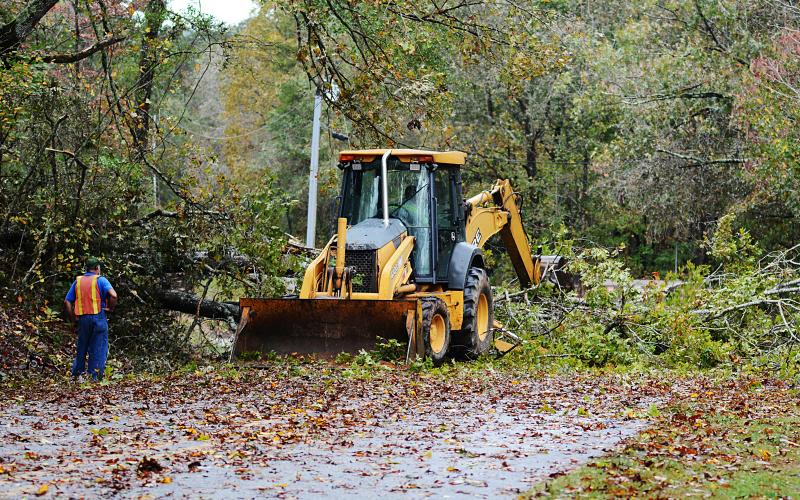 A road crew clears a tree across Payne's Creek road in Hart County Thursday morning. 