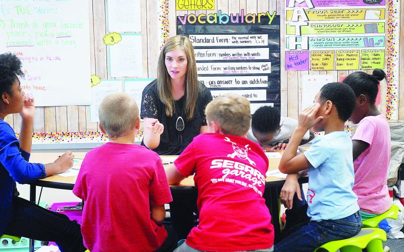 Sunshot from file - Andrea Gibbs works with students in her class in 2018 at Hartwell Elementary. 