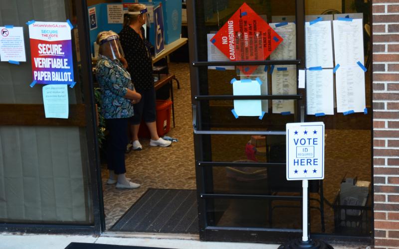 Sunshot by Michael Hall - Early voting lines moved swiftly Wednesday morning at 150 Benson Street in the basement of the Hart County Library. 