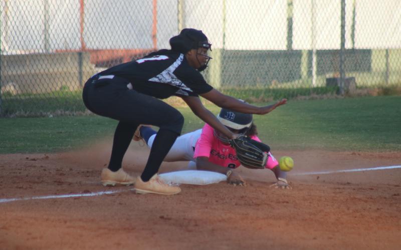 Sunshot by Grayson Williams -  Jazania Shealer attempts to make a play at third base in the Lady Diamond Dogs’ win over East Jackson on Tuesday, Oct. 6.