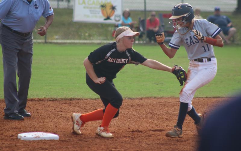 Sunshots by Grayson Williams Gabby Buffington tags an East Jackson runner out during the Lady Diamond Dogs’ victory in the Region 8-AAA tournament on Monday. 