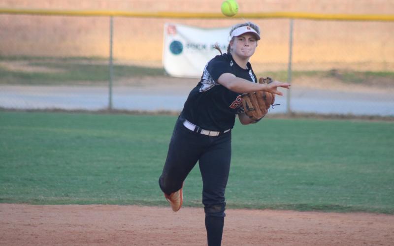 Annslee “Boo” Mitchell throws to first base during the Diamond Dogs’ victory over East Jackson on Tuesday, Oct. 6, at Hart County High School. 