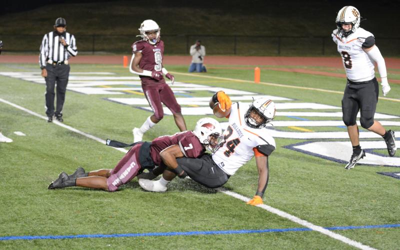 Hart’s J.L. Lackey falls into the endzone for a touchdown on Friday in Atlanta against Carver. 