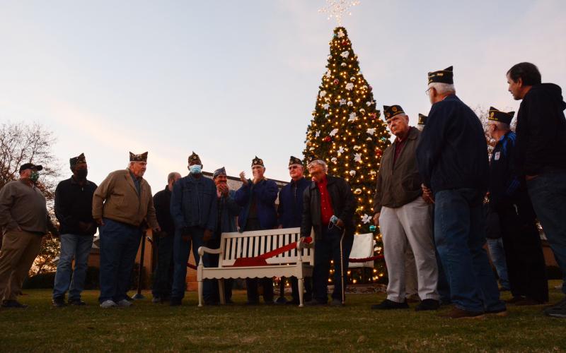 Veterans from American Legion Post 109 pull the lever to light the Christmas tree on the square in downtown Hartwell. 