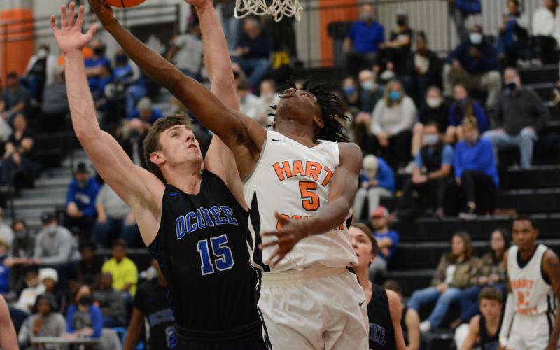 Sunshot by Grayson Williams - Jay Heard finds room to score on an Oconee County player on Friday, Jan. 22.