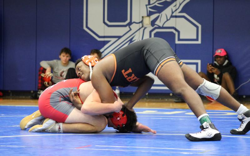 Photo by Mandy Patton - Elijah Hester wrestles against a Stephens County opponent at the Region 8-AAA tournament on Saturday, Jan. 16, at Oconee County High School.