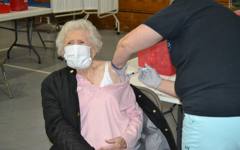 Sunshot by Drew Dotson - Hart County resident Doris Mahannah, who is 104 years old, gets her second dose of the COVID-19 vaccine on Tuesday, at Flat Shoals Baptist Church in Bowersville.