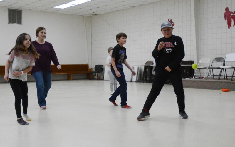 HYDRA winter break camp participants and director Mindy Wise, second from left, play wall ball on Tuesday, Feb. 16.
