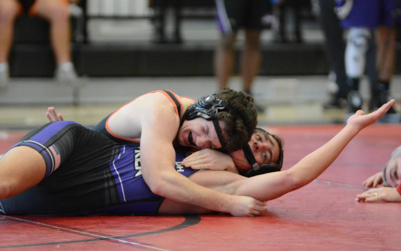 Sunshot by Grayson Williams Maverick Neal tries to pin his opponent at Stephens County High School on Saturday, Feb. 6, during the Region 8-AAA traditional wrestling tournament.