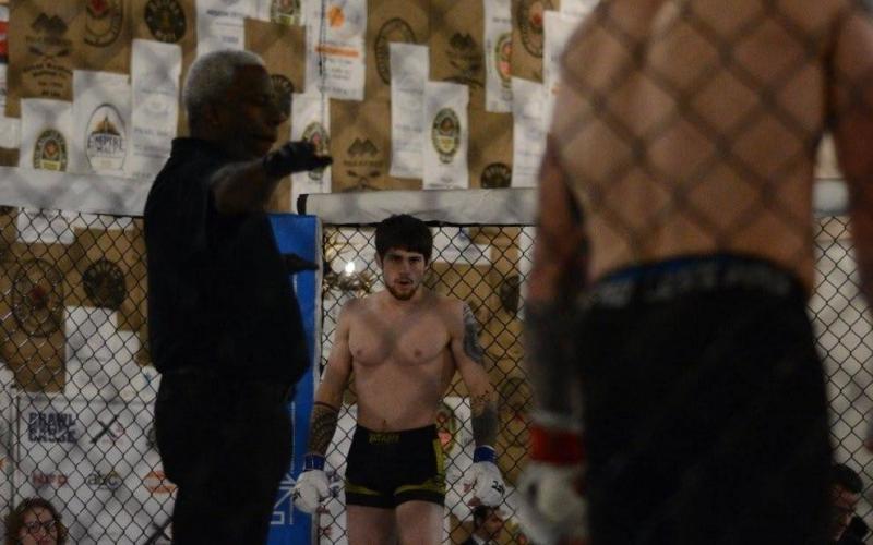 Photo submitted - Christian Hardin stands across the cage from his opponent at a prior NFC event. Hardin fights again on June 12 in Anderson, S.C. at NFC 133.