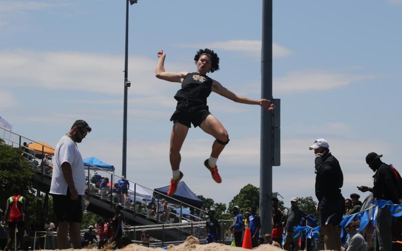 Marcus Etienne/ The Toccoa Record - Hart County’s J.C. Curry soars through the air during a field event in the sectional tournament at East Jackson on May 8.