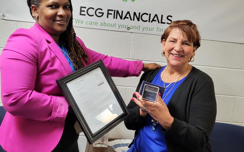 Ella Goodman, left and Angela Cann, right, smile after winning the Tax Year 2020 Excellence in powering client prosperity award. 