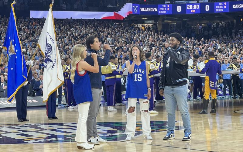 Former Hart County High School student athlete and current North Carolina Tar Heel linebacker Kaimon Rucker (far right) joins his peers from Duke University, Villanova University and Kansas University in a rendition of the national anthem before the men’s basketball Final Four in New Orleans on Saturday.  