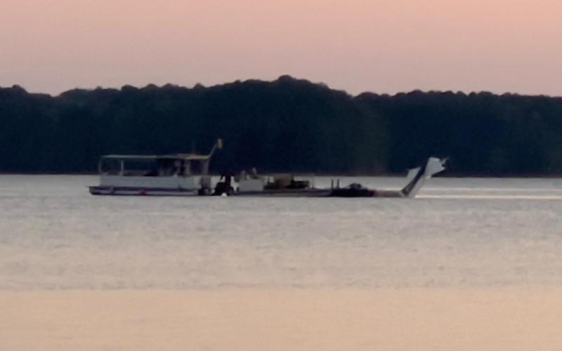 A plane which crashed in Lake Hartwell killing one on Sept. 10 is towed out of the water by specialists on the evening of Sept. 15 after a long recovery operation orchestrated by federal, state, local and out-of-state groups and agencies. 