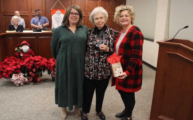 Pictured, from left to right, are Hart County Board of Education Chair Kim Pierce, award recipient Nancy Clark, and Superintendent Jennifer Carter. 