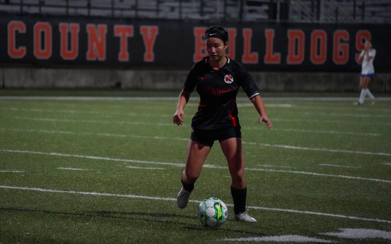 Senior forward Honor Chiang dribbles down the field as she scored two goals to pick up the Lady Dogs 4-2 win over Banks in the home opener to pick up the first win of the year. Photo taken by Lexie Wheless.