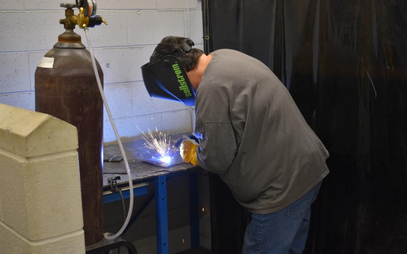 Sue Couch, a participant in the second installment of the adult welding class, works on her final project at the end of the four-week course. 