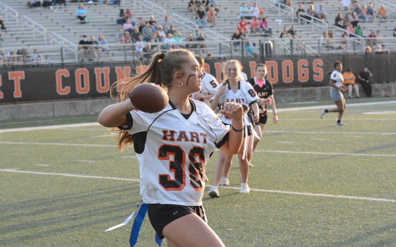 Pictured is junior Dakota Phillips as she throws a pass for a touchdown enroute to a 21-6 win for the juniors.