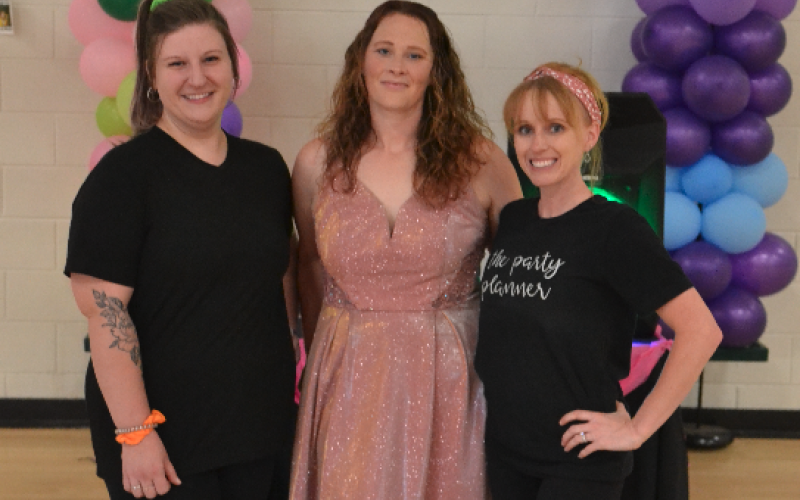 Pictured during the ‘Pumped Up Kicks’ dance and shoe drive at North Hart Elementary School are event planners and organizers (L-R) Jessica Caparas, Elizabeth Rossi and Amber Palmer. The event gave dozens of shoes to local kids. 
