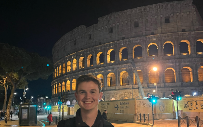 Dawson Baker stands in front of the Colosseum in Rome, Italy during Easter weekend. The Colosseum was constructed during the first century A.D.   