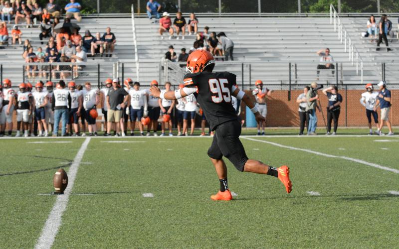 Rising senior kicker Axsel Fajardo gets ready to boot the ball away to kickoff the 2023 spring game versus Habersham Central on Friday, May 19.