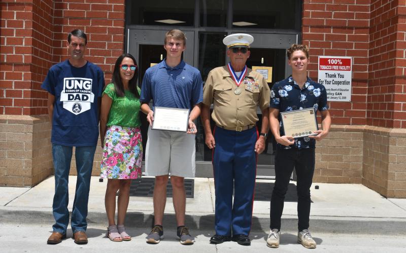 The Georgia Military Veterans Hall of Fame recently presented certificates to two Hart County High School graduates. Pictured from left are Keith McLane, Jamie McLane, Kaden Johnson-McLane, Chief Warrant Officer 4 Ray Fairman (retired) and Andrew Brezeale.