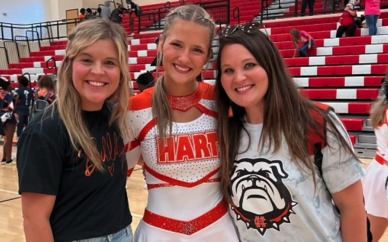 Pictured left from left to right is Hart County’s competition cheer head coach Mollie Payne, Amelia Johnson, and assistant coach Ashley Risner.