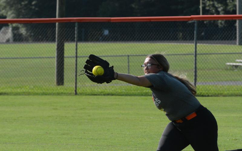Senior outfielder Alexis Davis dives for the catch during a summer practice as they prepare for their season opener on the road versus Jackson County on August 8.