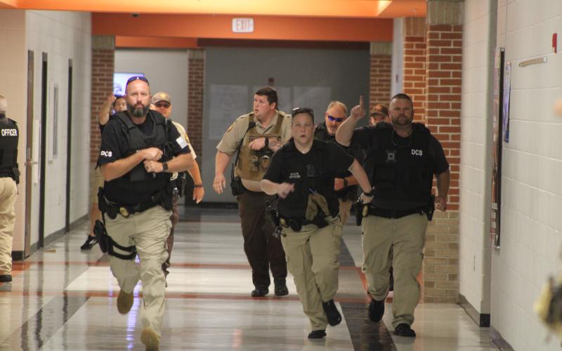 Law enforcement officers from multiple agencies clear the halls of Hart County High School during an Active Shooter Simulation Drill.