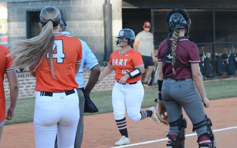 Senior outfielder Alexis Davis (41) trots home after smashing a two-run home run in the 8-4 home loss to Hebron Christian.