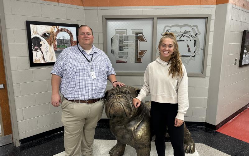 Hart County High School senior Dakota Phillips, pictured right, poses for a photo with Principal Kevin Gaines, left, after receiving news that she was selected to serve on the State School Superintendent’s Advisory Council.