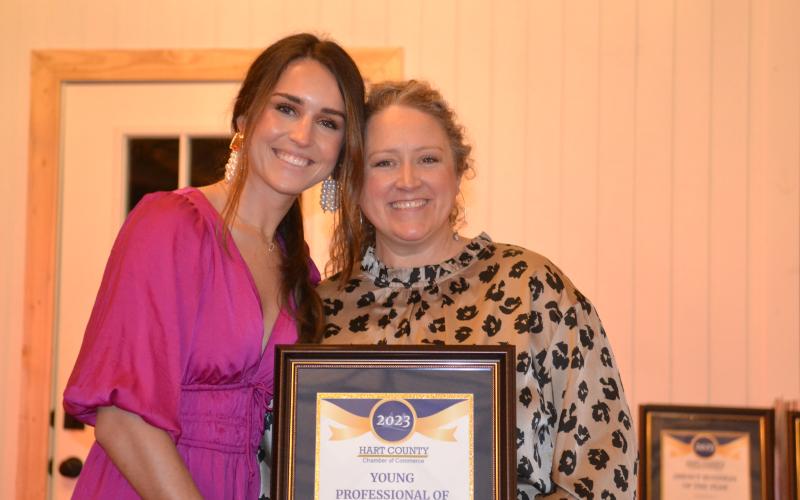 Hart County Chamber of Commerce Executive Director Lindsey Ingle presents owner Eliza Banks of Banks Hollow with the Young Professional of the Year award Jan. 27 during the chamber’s awards gala. 