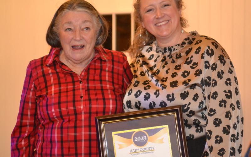 Director of Hart Interdenominational Ministry Christina Silpe (left) receives the Community Champion Award from Chamber director Lindsey Ingle.
