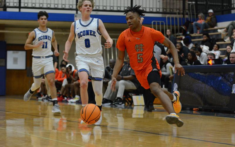 Senior guard Jashon Gaines sprints to the basket in transition in the win over Oconee.