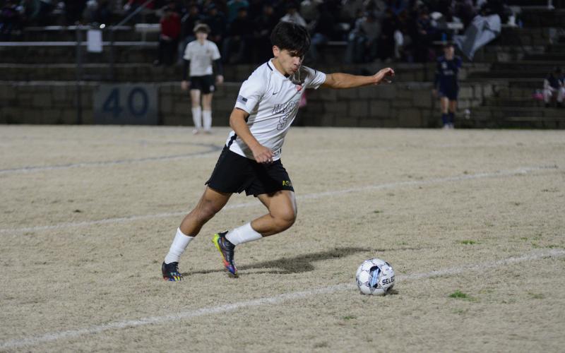 Pictured at the bottom is senior forward Axsel Fajardo as he scored the lone goal in the 3-1 loss against Rabun County on Feb. 13.
