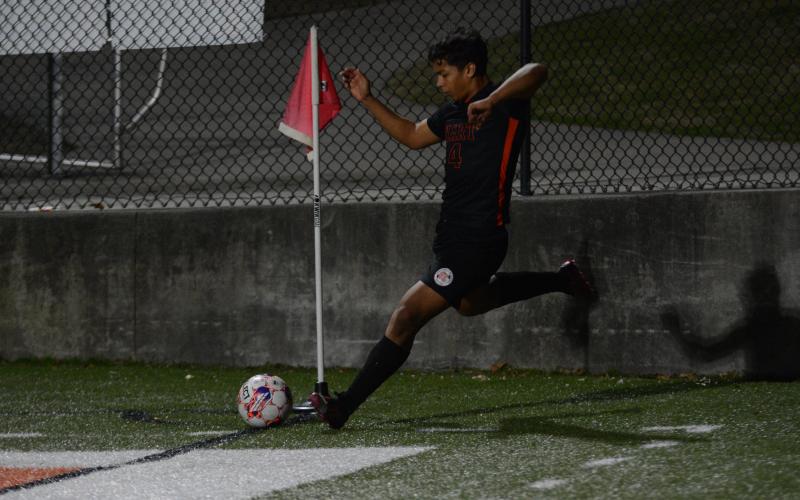 Pictured is Fabian Rodriguez Escobedo as he scores on a corner against Washington-Wilkes.