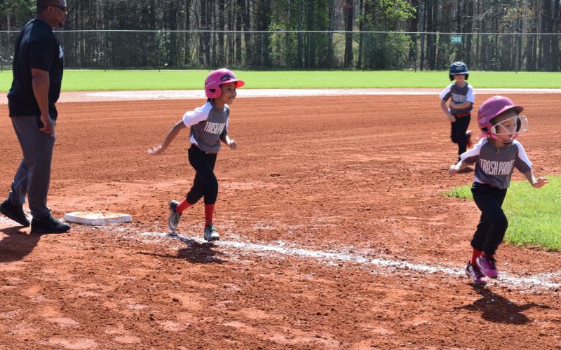 Pictured is Khloe Morrison rounding third.