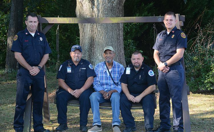 Sunshot by Michael Hall — Hartwell firefighter Jonathan Miller, from left, Hart County EMT Ronald Dutton, Raisel HM RA, Hart County EMT Ronnie Thompson and Hartwell firefighter Bobby Lewis pose for a photo after talking about the experience when the first responders, including firefighter John Moore and EMT Brian Evans, not pictured, saved HM RA’s life.