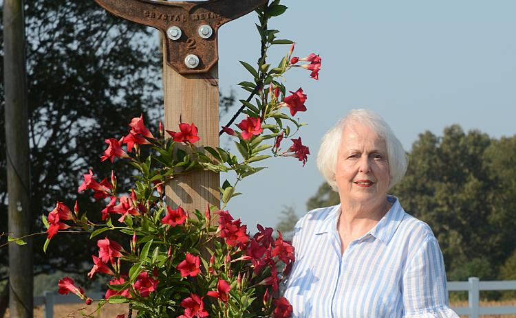 Sunshots by Michael Hall Mary Jo Shiflet poses for a photo, above, near an old farm bell in her yard just outside of Hartwell. Shiflet, 78, has a positive outlook on life despite tragedies from the past. 