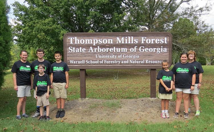 Photo submitted — 4-H’ers pose for a photo at the Thompson Mills Forest State Arboretum in Braselton. They are, from left to right, coach Ruth Daniel, Kaleb Waddell, Charlie Jones, Ashleigh Jones, Emma Shiflet, coach AnnaMarie Harrison. Standing in front is Aric McBride.