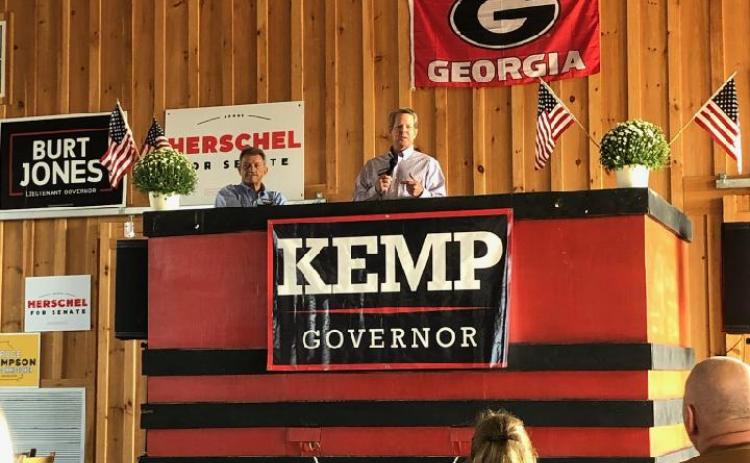 Governor Brian Kemp, alongside state House Rep. Alan Powell, speaks to an audience at Britt Angus Farm in Hartwell on Saturday, Sept. 17. Kemp was one of 10 notable Republican speakers in a “Meet the candidates” event.
